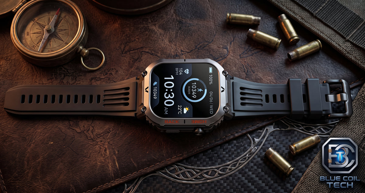 A rugged smartwatch with a black strap and metallic silver-toned case, displayed on a dark textured leather surface with a compass, bullet casings, and a branded Blue Coil Tech logo in the corner.